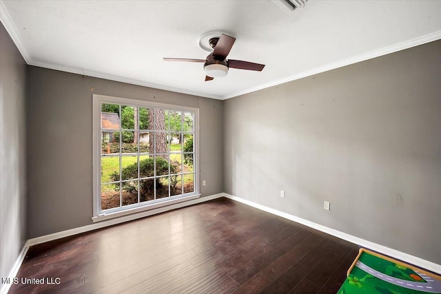 empty room featuring crown molding, ceiling fan, and dark hardwood / wood-style flooring