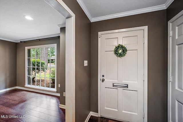 entrance foyer with ornamental molding, a textured ceiling, and dark hardwood / wood-style flooring