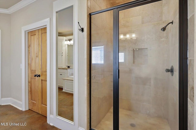 bathroom with ornamental molding and a shower with door