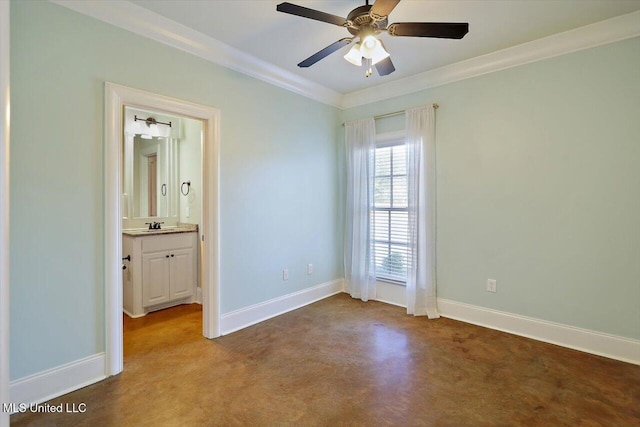 spare room featuring ceiling fan, ornamental molding, and sink