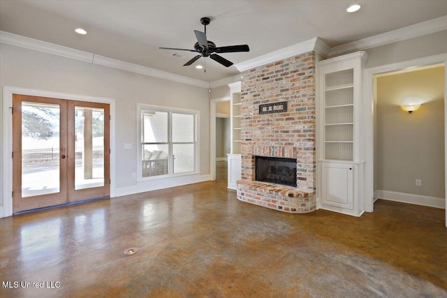 unfurnished living room with french doors, built in shelves, crown molding, ceiling fan, and a fireplace