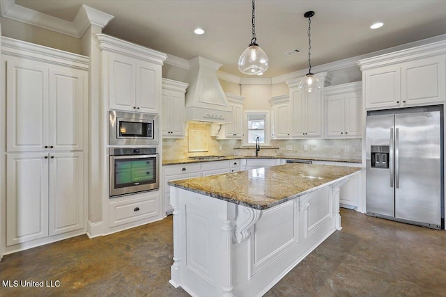 kitchen with premium range hood, appliances with stainless steel finishes, a center island, and white cabinets