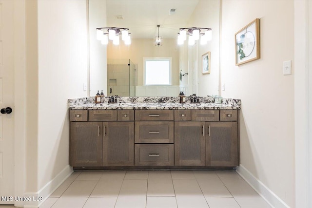 13604 Live Oak Loop, Olive Branch, MS 38654 - full bathroom with a stall shower, double vanity, and baseboards