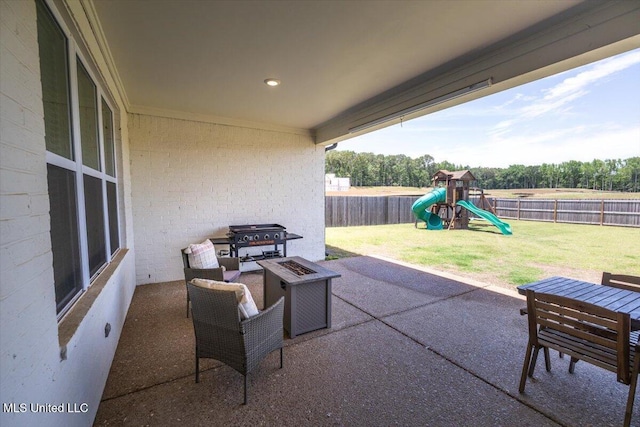 13604 Live Oak Loop, Olive Branch, MS 38654 - view of patio with a playground, an outdoor fire pit, and grilling area