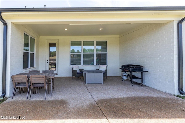 13604 Live Oak Loop, Olive Branch, MS 38654 - view of patio featuring outdoor dining area and an outdoor hangout area
