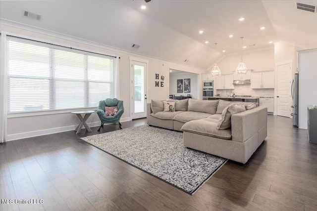 13604 Live Oak Loop, Olive Branch, MS 38654 - living area with vaulted ceiling, dark wood finished floors, baseboards, and recessed lighting