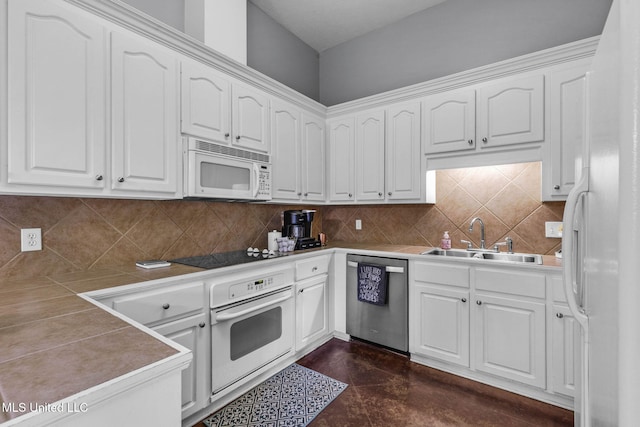 115 Deer Creek Cv, Madison, MS 39110 - kitchen featuring white appliances, a sink, white cabinets, and backsplash