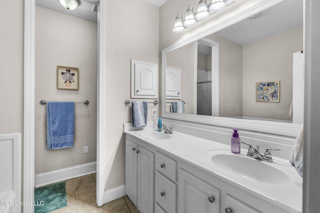 115 Deer Creek Cv, Madison, MS 39110 - bathroom featuring double vanity, tile patterned floors, and baseboards