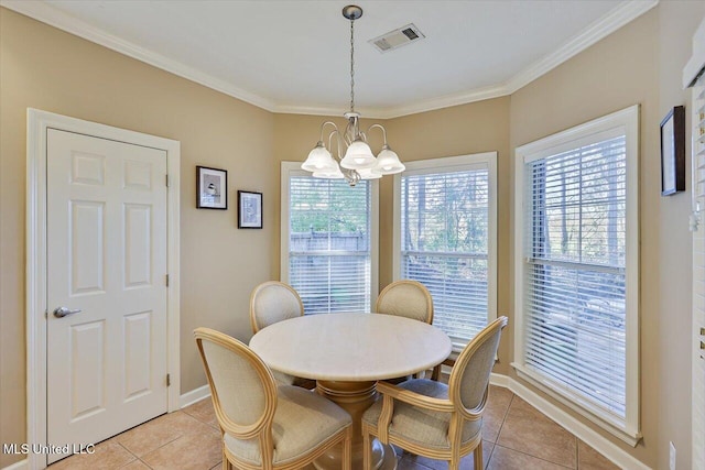 tiled dining space featuring a chandelier and ornamental molding