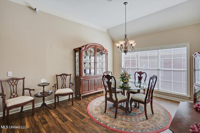 dining area with dark wood-type flooring, vaulted ceiling, and a healthy amount of sunlight