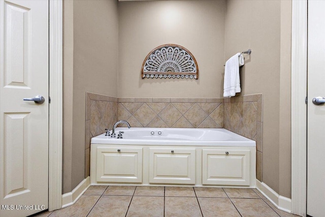 412 Dunlin Ct, Brandon, MS 39047 - bathroom featuring tile patterned floors, a bath, and baseboards