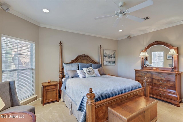 bedroom featuring light carpet, ceiling fan, and crown molding