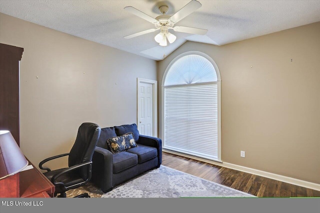 office featuring hardwood / wood-style floors, ceiling fan, lofted ceiling, and a textured ceiling