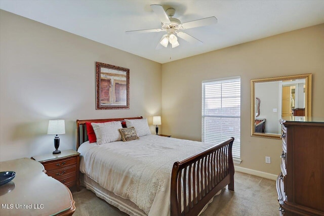 bedroom featuring ceiling fan and light carpet