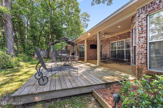 412 Dunlin Ct, Brandon, MS 39047 - wooden terrace with a ceiling fan, outdoor dining space, and a yard