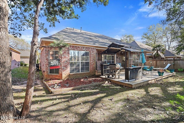 rear view of house with a patio area and a yard