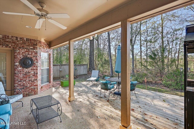 view of patio / terrace with a deck and ceiling fan