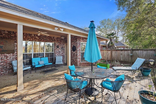 view of patio with outdoor lounge area, a deck, and ceiling fan