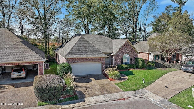 view of front of home with a front yard and a garage