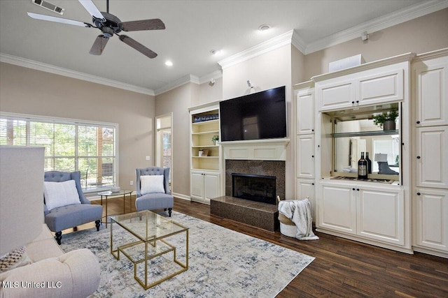 412 Dunlin Ct, Brandon, MS 39047 - living room featuring dark wood-type flooring, crown molding, a high end fireplace, recessed lighting, and a ceiling fan