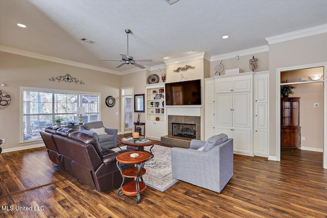 living room featuring dark hardwood / wood-style flooring, ceiling fan, and crown molding