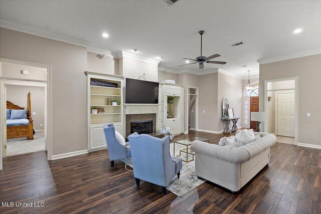 412 Dunlin Ct, Brandon, MS 39047 - living room featuring dark wood-type flooring, baseboards, recessed lighting, ceiling fan, and a glass covered fireplace