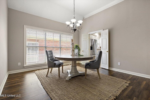 412 Dunlin Ct, Brandon, MS 39047 - dining room with a chandelier, crown molding, baseboards, and dark wood-style floors