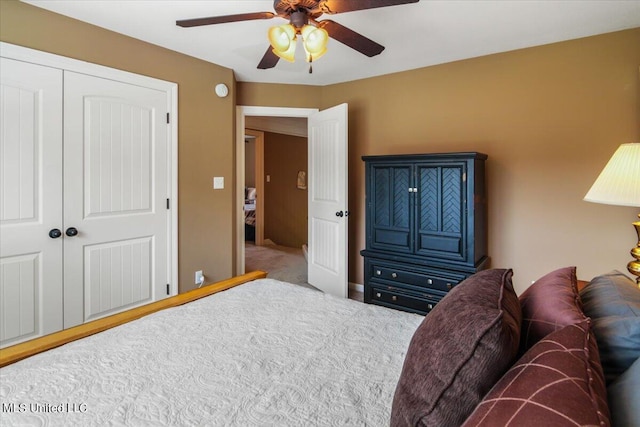 bedroom featuring a closet, ceiling fan, and carpet flooring