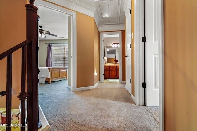 hallway featuring light carpet and ornamental molding