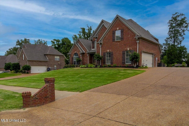 front of property featuring a front yard and a garage