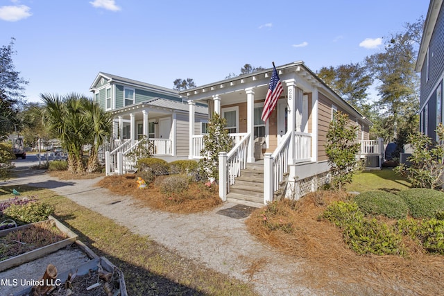 view of front facade featuring a porch and central air condition unit