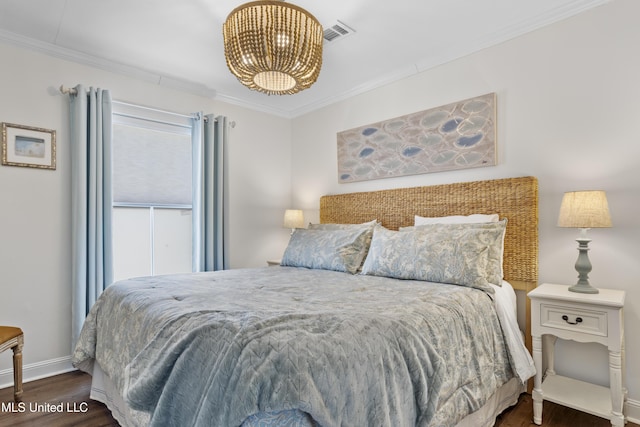 bedroom with dark hardwood / wood-style floors