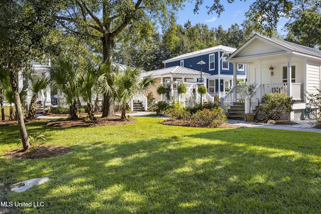 view of front of home with a porch and a front yard