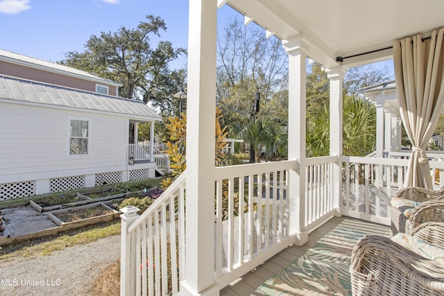 wooden deck featuring a porch