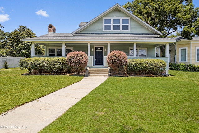 view of front of home with a front lawn and covered porch