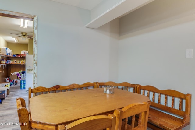 dining room with a ceiling fan and wood finished floors