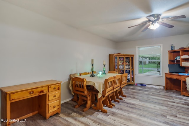 dining room featuring light wood-style flooring and ceiling fan
