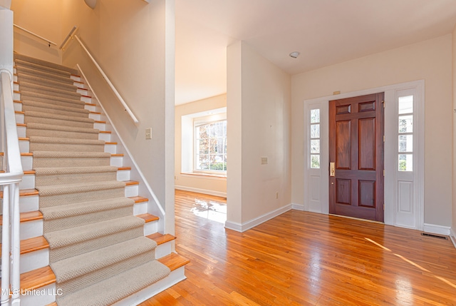 foyer with wood-type flooring