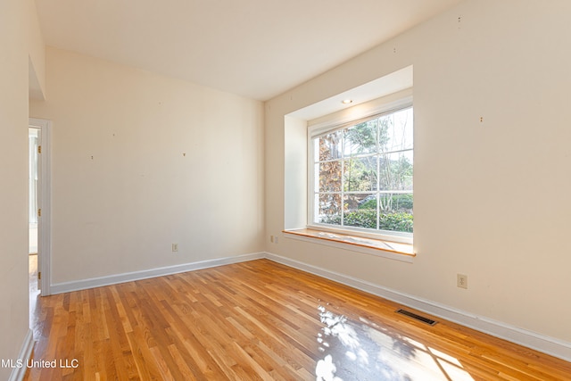 unfurnished room featuring light hardwood / wood-style flooring