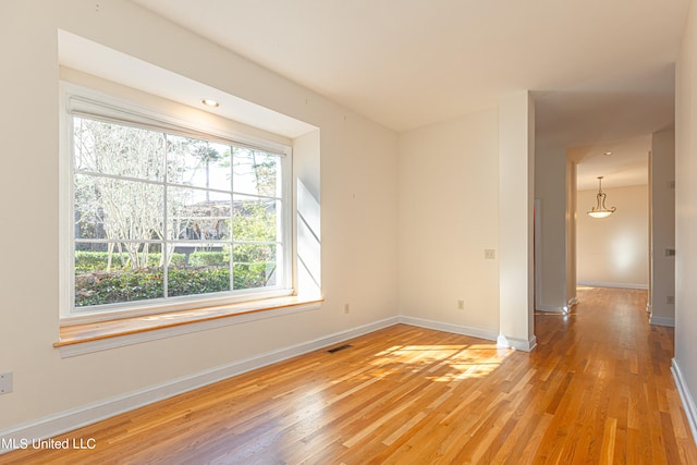 empty room featuring hardwood / wood-style flooring
