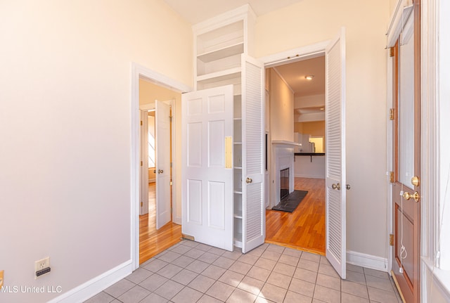 hallway with light wood-type flooring