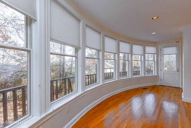 unfurnished sunroom featuring plenty of natural light