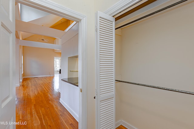hallway with light hardwood / wood-style flooring