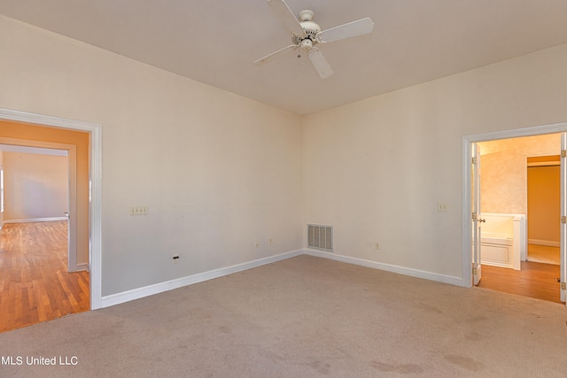 spare room featuring ceiling fan and light wood-type flooring
