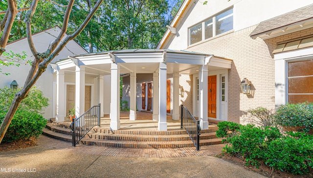 entrance to property with a porch