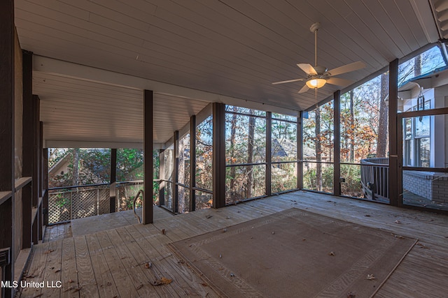 unfurnished sunroom featuring vaulted ceiling and ceiling fan