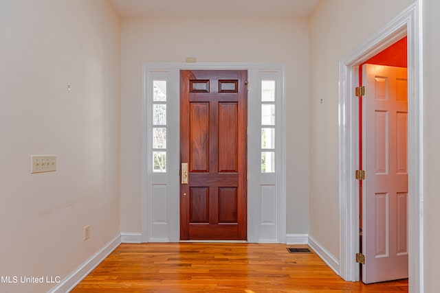 entrance foyer featuring light hardwood / wood-style floors and plenty of natural light