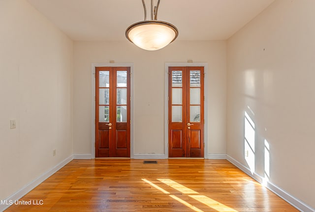 foyer with light wood-type flooring