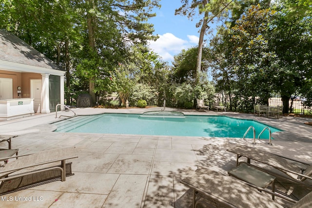 view of swimming pool featuring a patio area