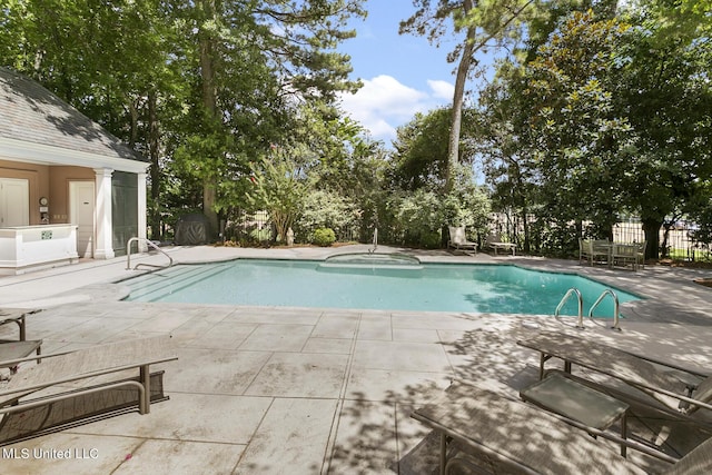 view of pool featuring a patio area and a fenced in pool
